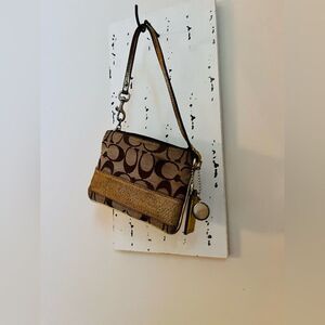 Coach Brown and Tan Signature Wristlet with gold stripe. Vintage 
4x6 inches